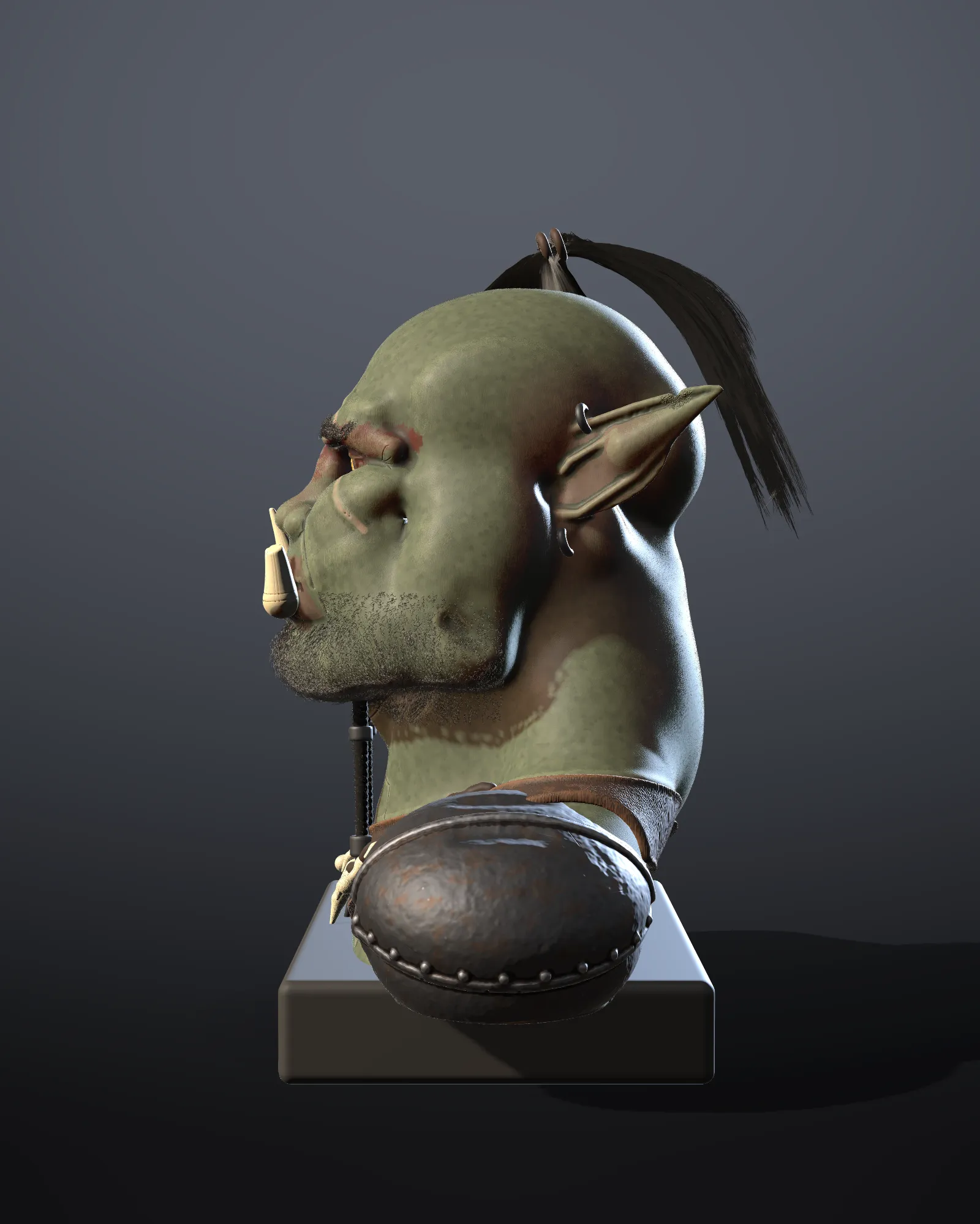 The orc bust in profile under hard side light with a cool rim
